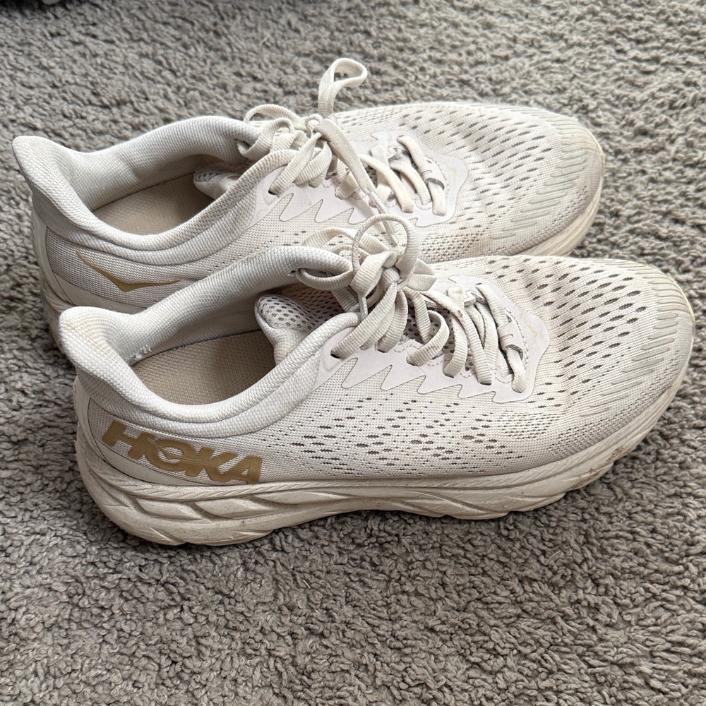 Hoka Cream and Gold Athletic Shoes